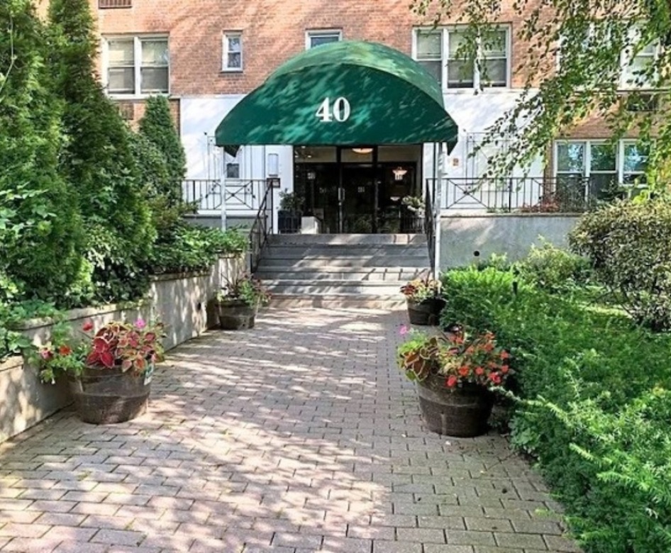 the front of a building at street level with trees