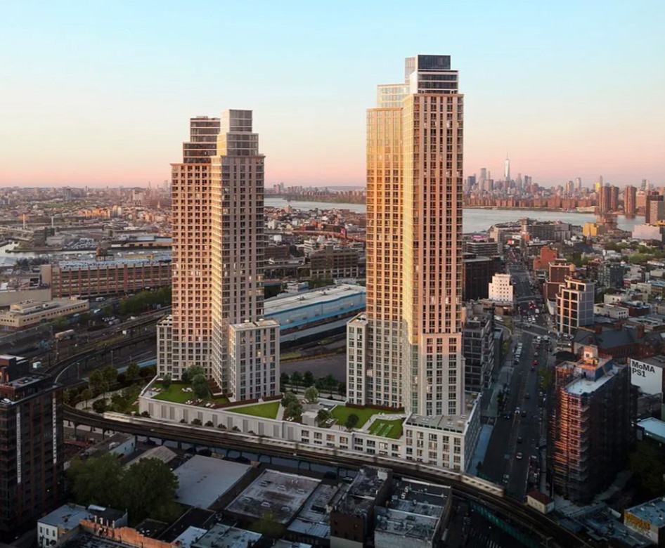aerial view of two tall buildings in a city