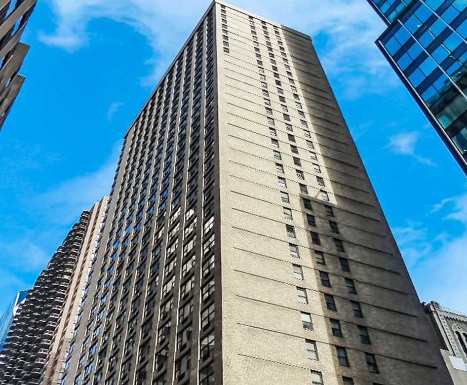the front of a tall building at street level