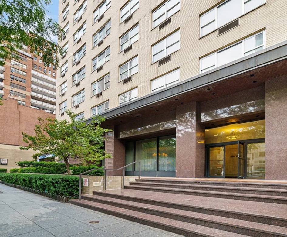 the front of a building at street level with trees