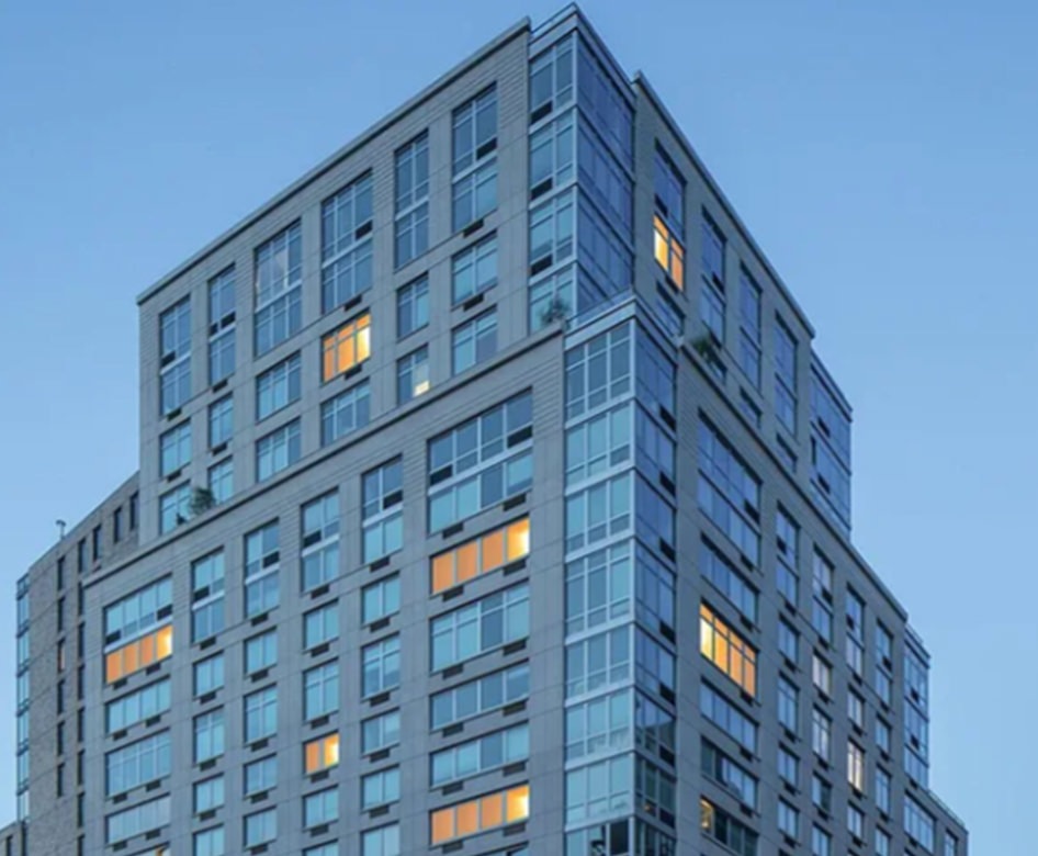 a tall building with several windows and floors