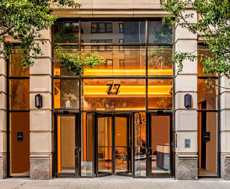 the front of a building at street level with trees