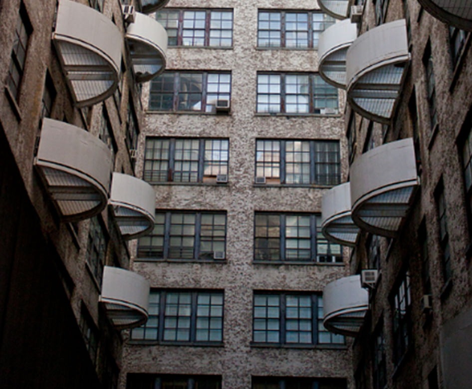 a courtyard with a building on all sides